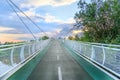 Empty bicycle bridge called Ã¢â¬ÅFreedom bridgeÃ¢â¬Â connecting two countries Slovakia and Austria during sunset Bratislava,